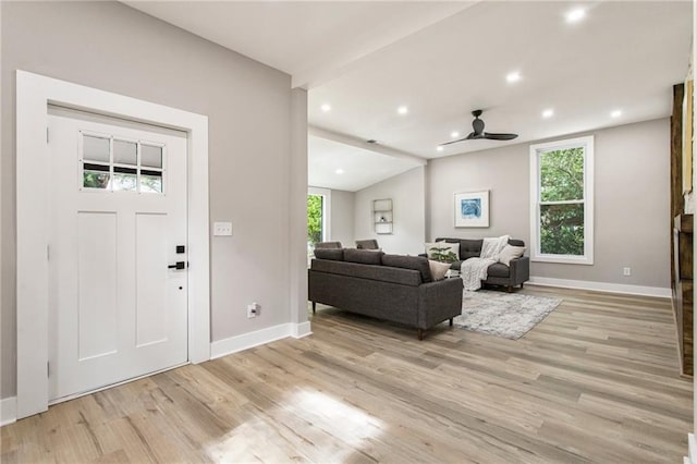 1510 Mims St SW, Atlanta, GA 30314 - living area featuring a ceiling fan, vaulted ceiling, light wood-style floors, and baseboards