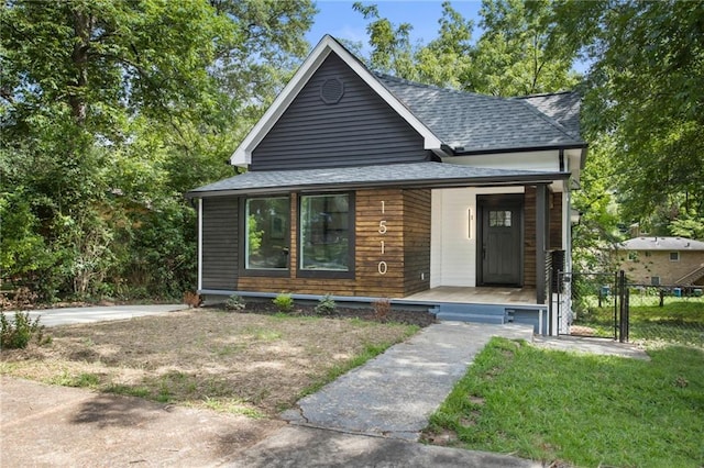 1510 Mims St SW, Atlanta, GA 30314 - view of front of property with fence, covered porch, and roof with shingles