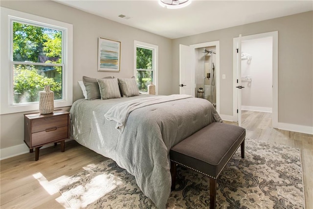 1510 Mims St SW, Atlanta, GA 30314 - bedroom with light wood-style flooring, multiple windows, visible vents, and baseboards