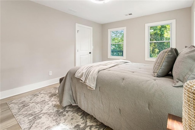 1510 Mims St SW, Atlanta, GA 30314 - bedroom featuring visible vents, baseboards, and wood finished floors