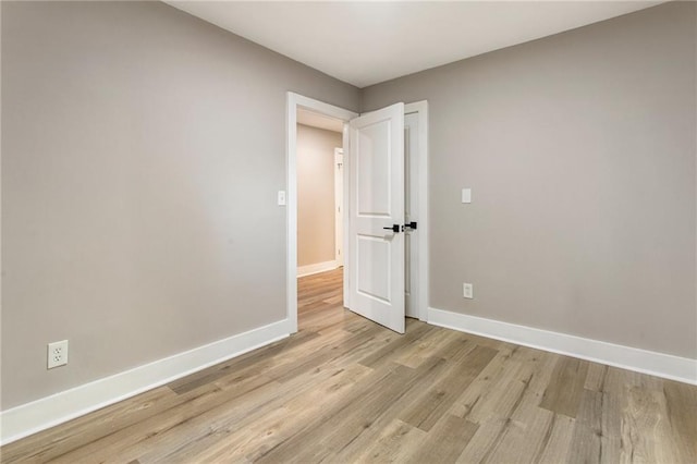 spare room featuring light hardwood / wood-style floors