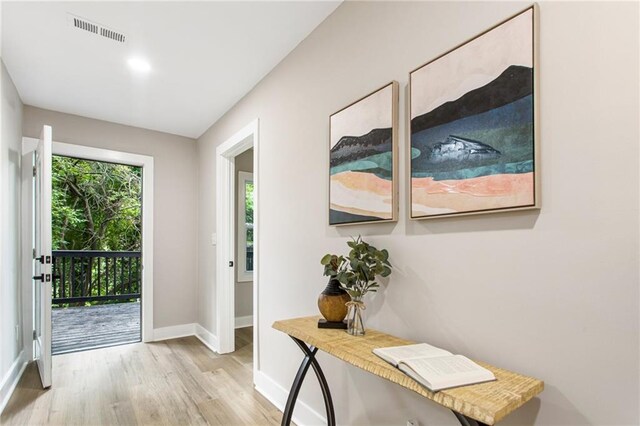 entryway with light hardwood / wood-style floors