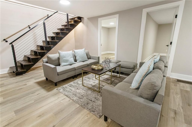 1510 Mims St SW, Atlanta, GA 30314 - living room with stairway, baseboards, visible vents, and wood finished floors