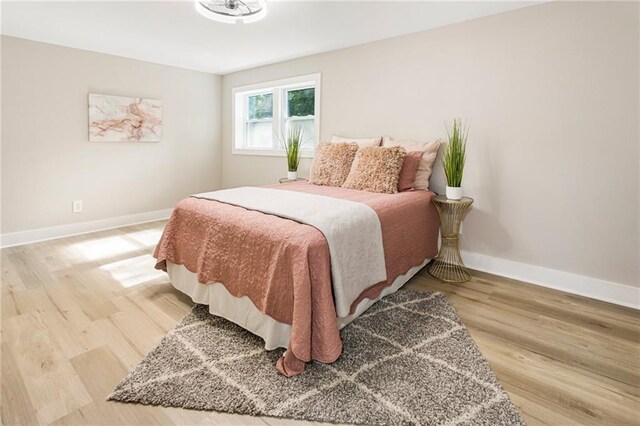 bedroom with light hardwood / wood-style flooring