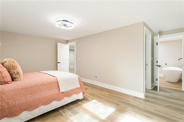 bedroom with light hardwood / wood-style floors