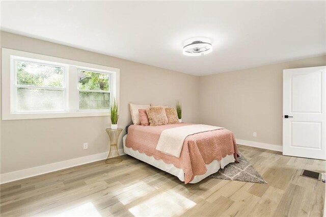 bedroom with light wood-type flooring