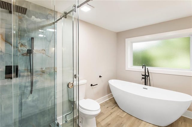 bathroom with a shower with shower door, wood-type flooring, and toilet