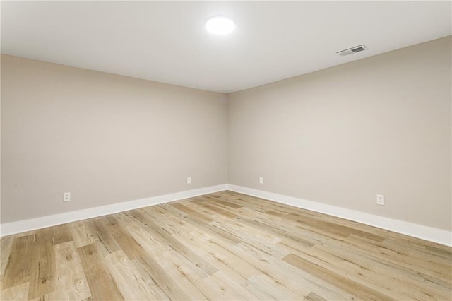 empty room with light hardwood / wood-style floors