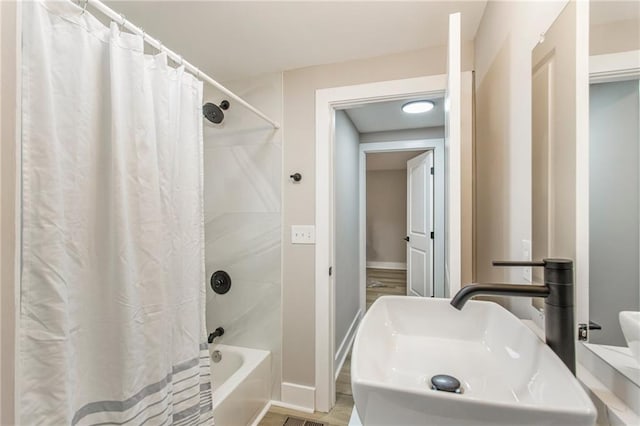 1510 Mims St SW, Atlanta, GA 30314 - bathroom with a sink, baseboards, and shower / bath combination with curtain