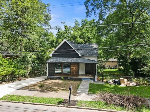 1510 Mims St SW, Atlanta, GA 30314 - view of front facade featuring covered porch, concrete driveway, and a shingled roof