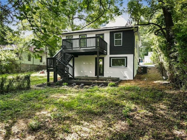 back of property with central AC and a wooden deck