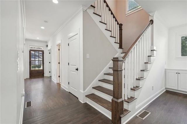 bathroom featuring a wealth of natural light, vanity, plus walk in shower, and ornamental molding