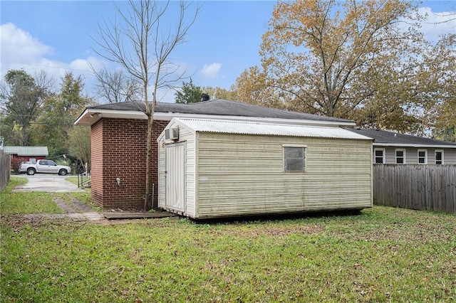 view of outbuilding with a lawn