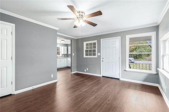 interior space with ceiling fan, dark hardwood / wood-style flooring, and crown molding