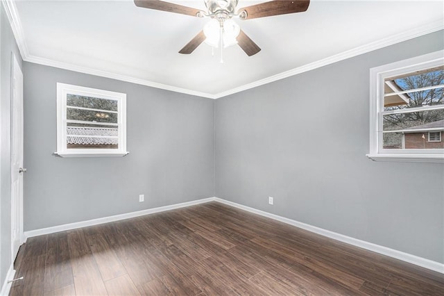 unfurnished room with ornamental molding, ceiling fan, and dark wood-type flooring