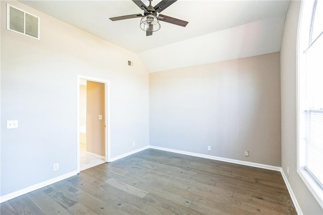 unfurnished room with ceiling fan, lofted ceiling, and hardwood / wood-style floors