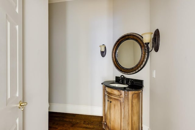 bathroom with vanity and wood-type flooring