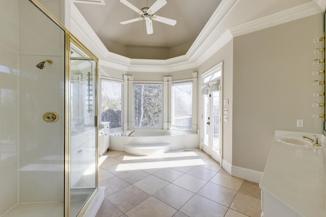 bathroom featuring plus walk in shower, ornamental molding, ceiling fan, a raised ceiling, and tile patterned floors