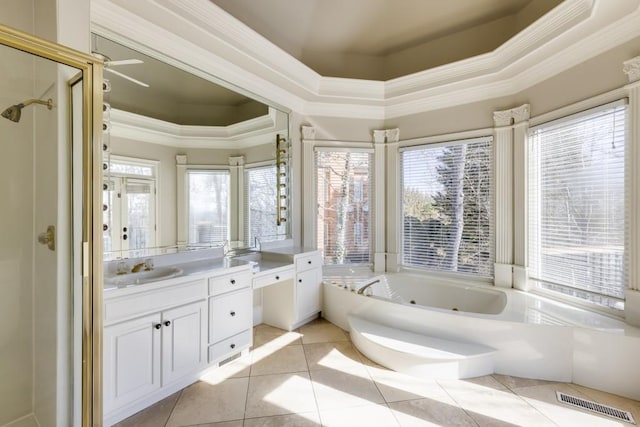 bathroom with crown molding, vanity, a tub to relax in, tile patterned floors, and a raised ceiling