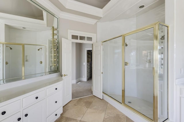 bathroom featuring vanity, crown molding, and walk in shower