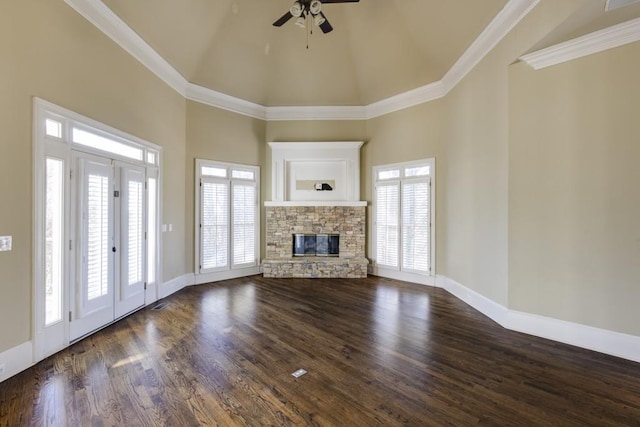 unfurnished living room with crown molding, a fireplace, dark hardwood / wood-style flooring, and high vaulted ceiling