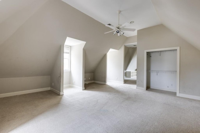 bonus room featuring vaulted ceiling, light carpet, and ceiling fan