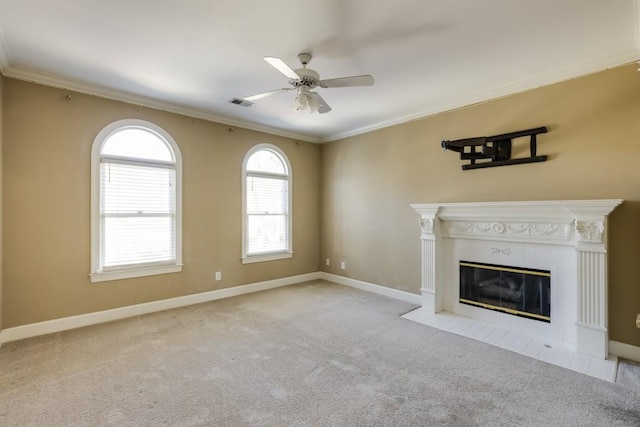 unfurnished living room with crown molding, a fireplace, and light colored carpet