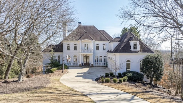 french country inspired facade featuring french doors