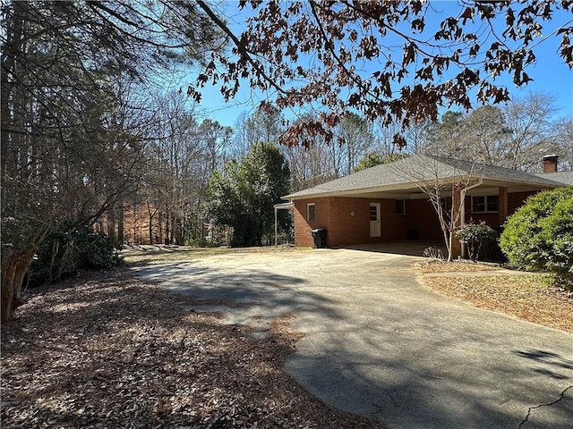 view of home's exterior with a carport