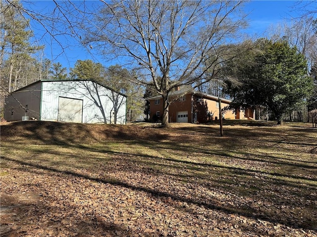 view of yard featuring a garage