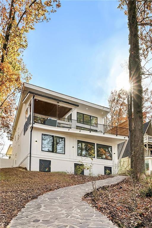 back of property with a balcony