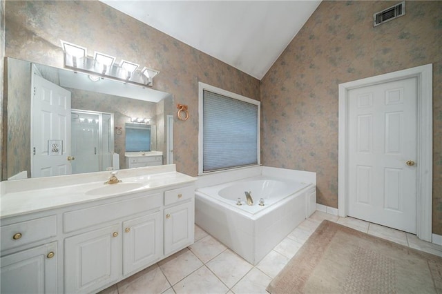 bathroom featuring vaulted ceiling, vanity, a stall shower, and wallpapered walls