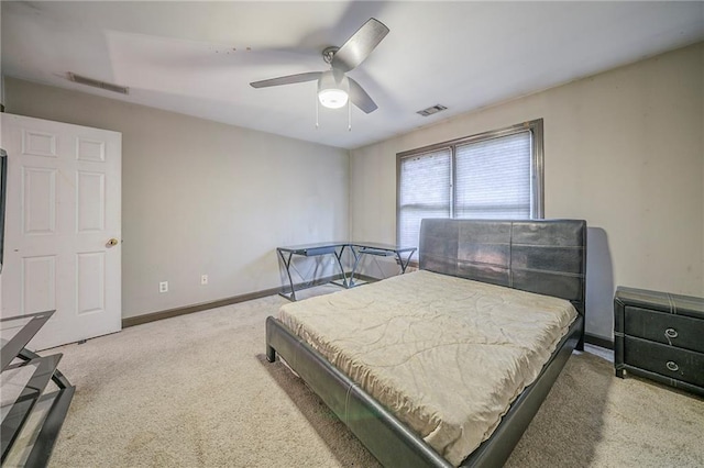 carpeted bedroom featuring ceiling fan, baseboards, and visible vents