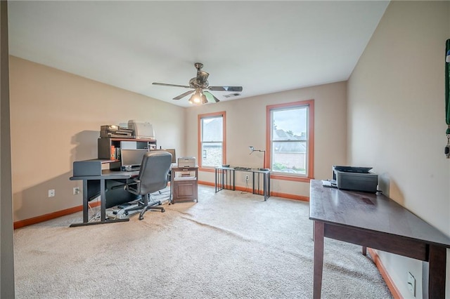 home office with baseboards, visible vents, a ceiling fan, and carpet floors