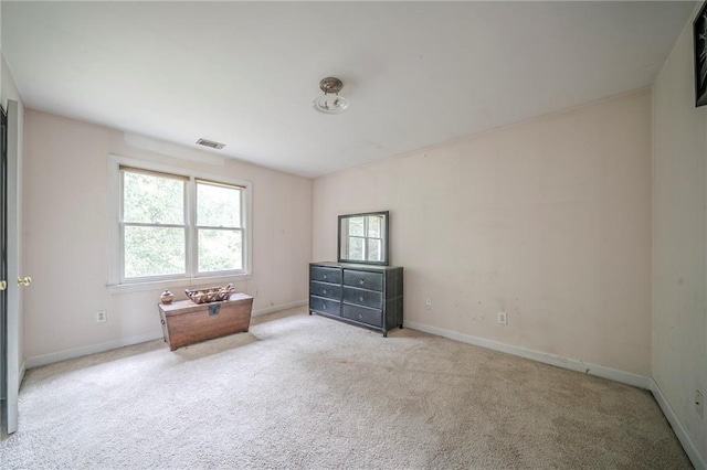 carpeted bedroom with baseboards, visible vents, and multiple windows