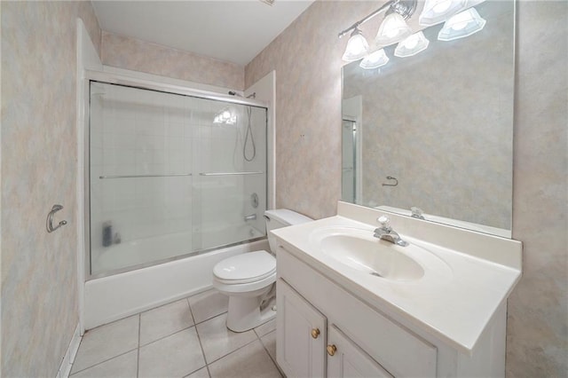 full bathroom with toilet, tile patterned floors, vanity, and enclosed tub / shower combo