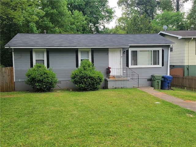 single story home featuring a front yard