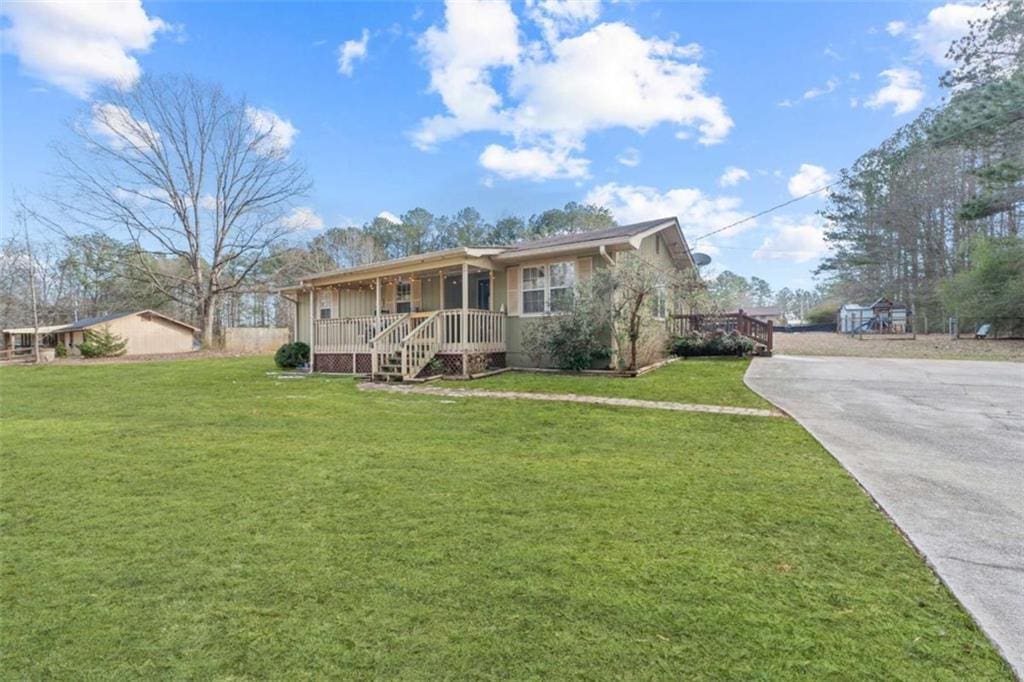 view of front of property with a front yard and a porch