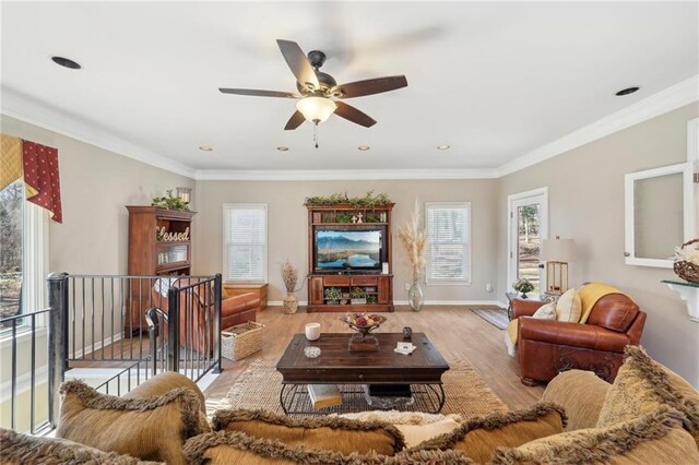 living room featuring ornamental molding and light hardwood / wood-style floors