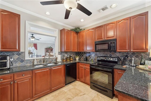 kitchen with ornamental molding, sink, dark stone countertops, and black appliances