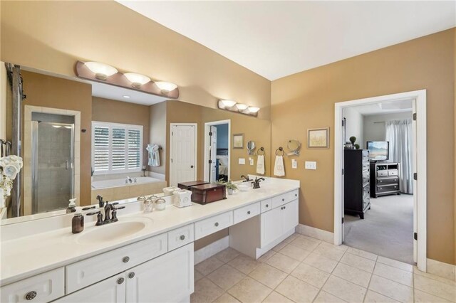 bathroom with vanity, tile patterned floors, and separate shower and tub