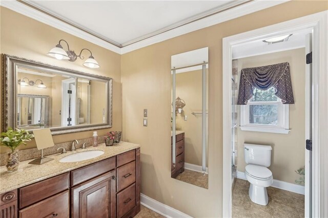 bathroom with vanity, crown molding, and toilet