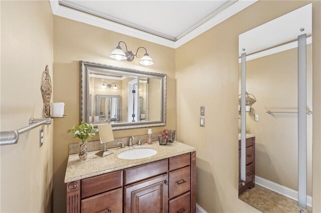 bathroom with vanity, tile patterned floors, and crown molding