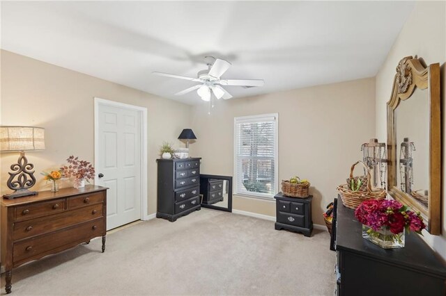 interior space with light carpet and ceiling fan