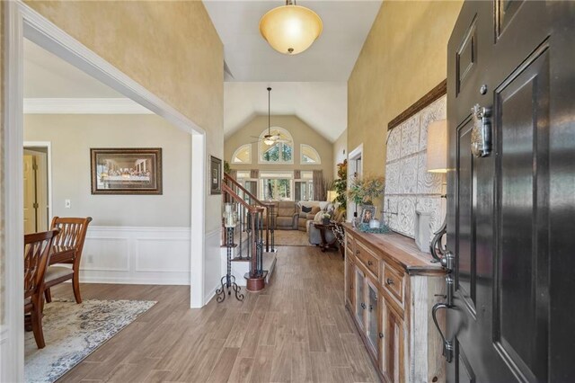 entryway featuring lofted ceiling and wood-type flooring