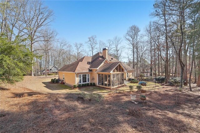 rear view of house with a sunroom