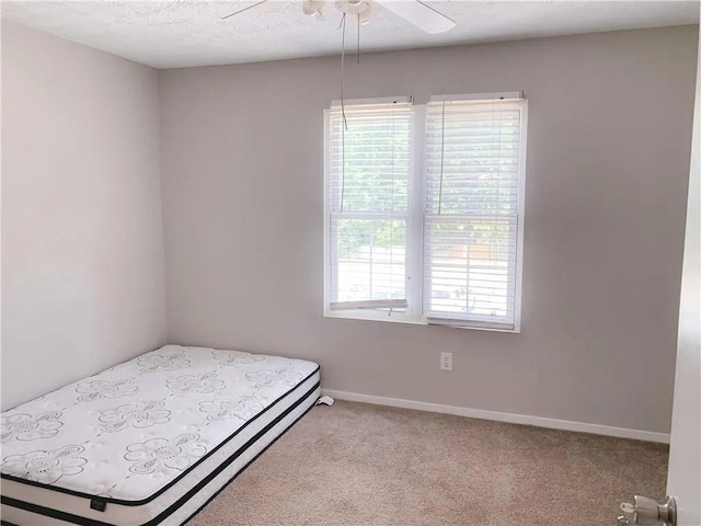 6658 Ramsgate Way, Norcross, GA 30093 - bedroom with multiple windows, light carpet, baseboards, and ceiling fan