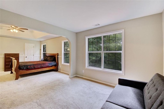 bedroom featuring light colored carpet and ceiling fan