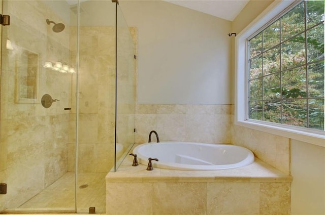 bathroom with lofted ceiling and separate shower and tub