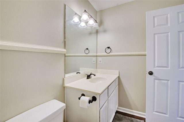 bathroom with vanity and toilet